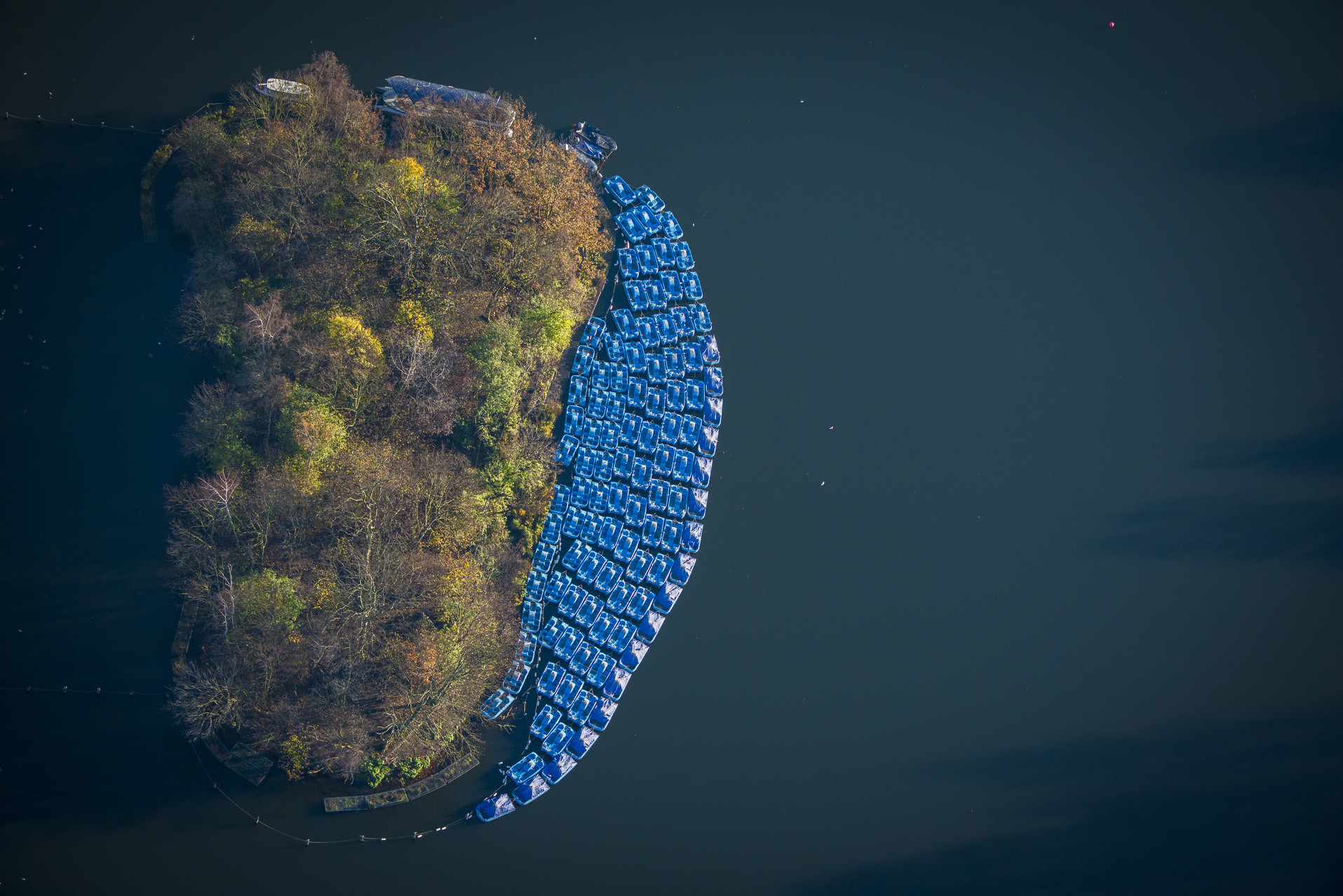 Aerial photo of pedalos and boats moored in the Serpentine