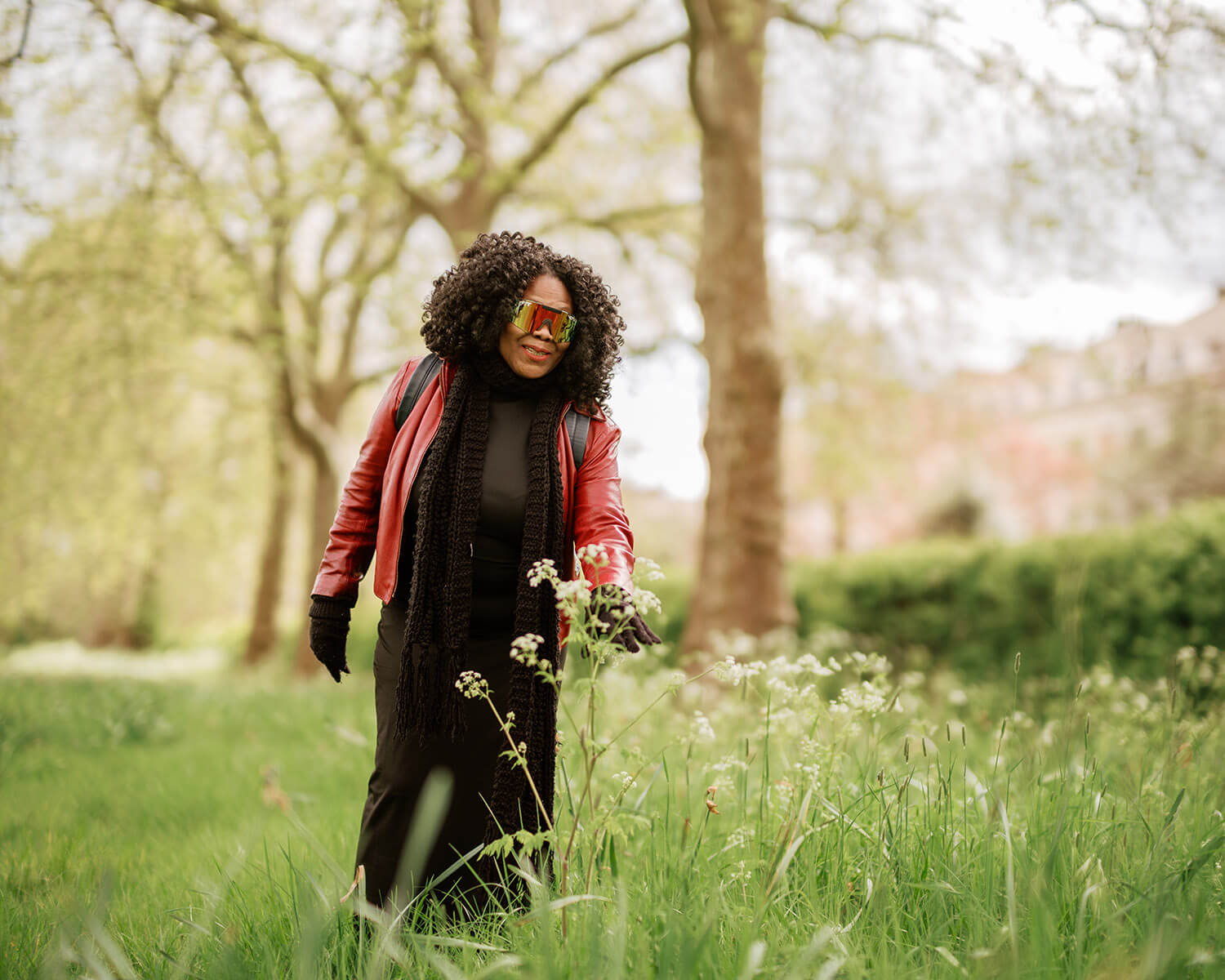 A woman looking at wildflowers