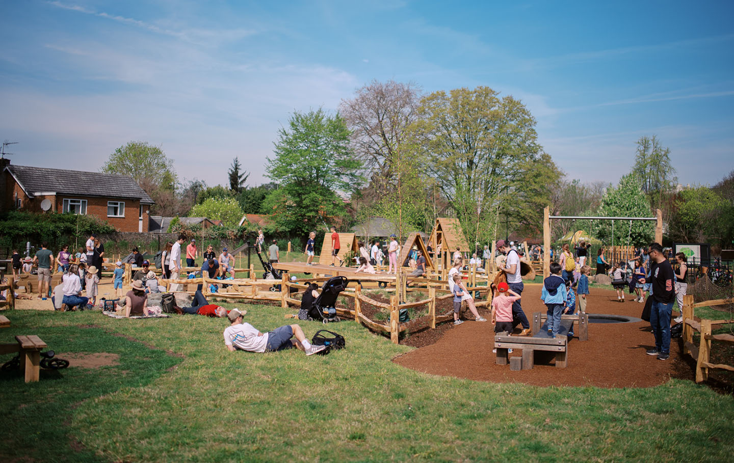 A busy playground on a sunny spring day