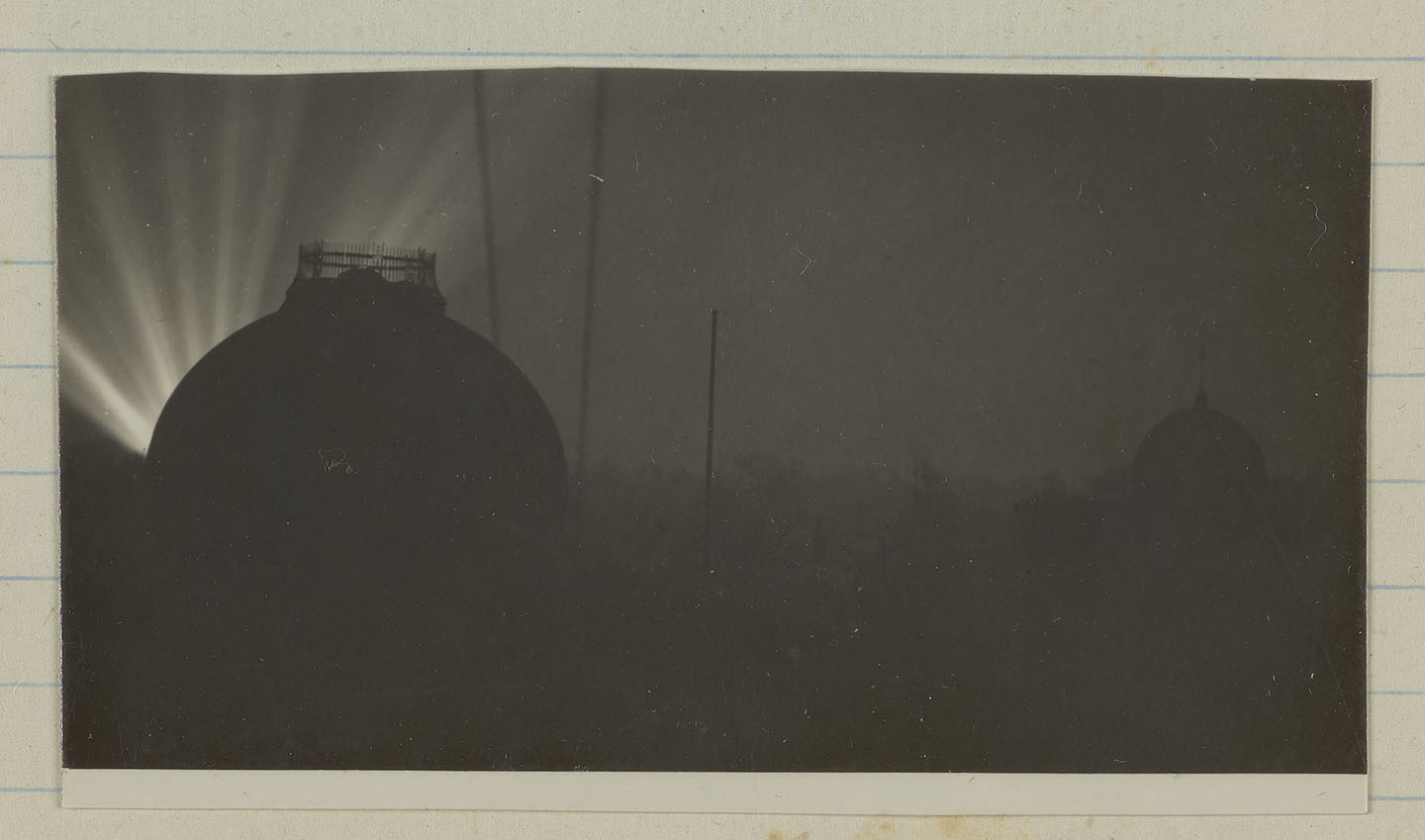 Black and white photograph showing Second World War searchlights over Greenwich Park