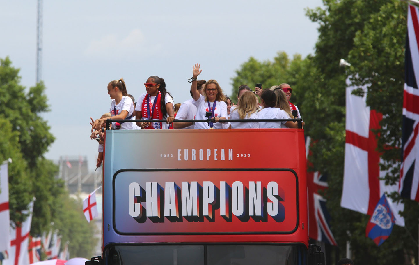 The 'Lionesses' wave to crowds and celebrate on an open-top bus