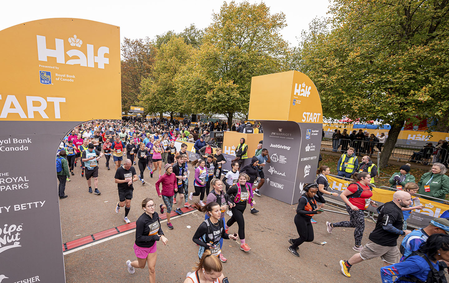 Crowds of runners starting the Royal parks Half Marathon