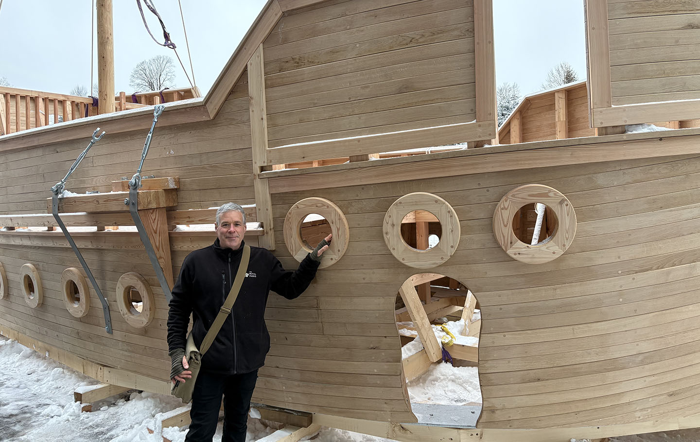 Andy Williams stands beside the new wooden play galleon