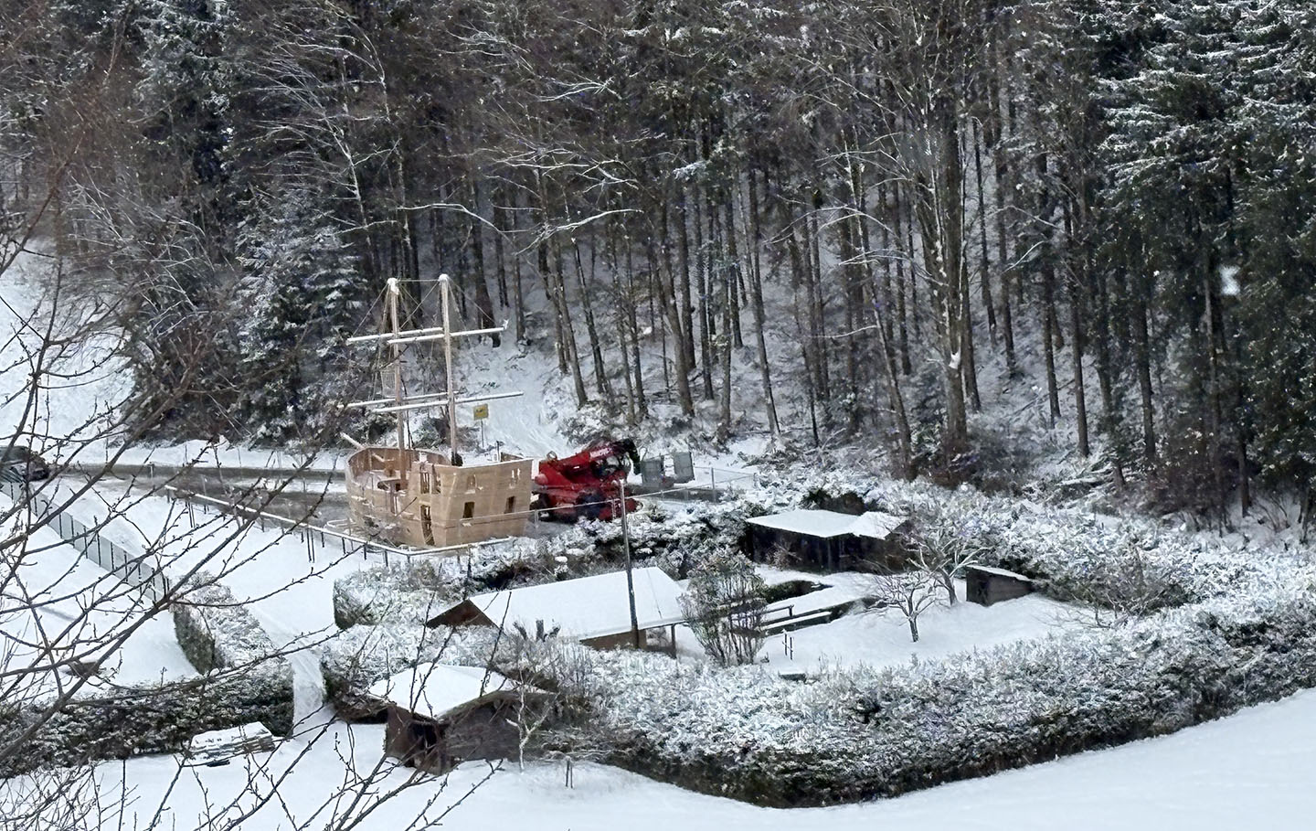The new wooden play galleon nestled in front of a snowy forest