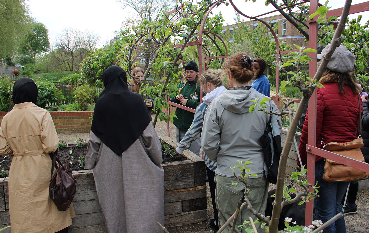 Group of people in the Queen's Orchard