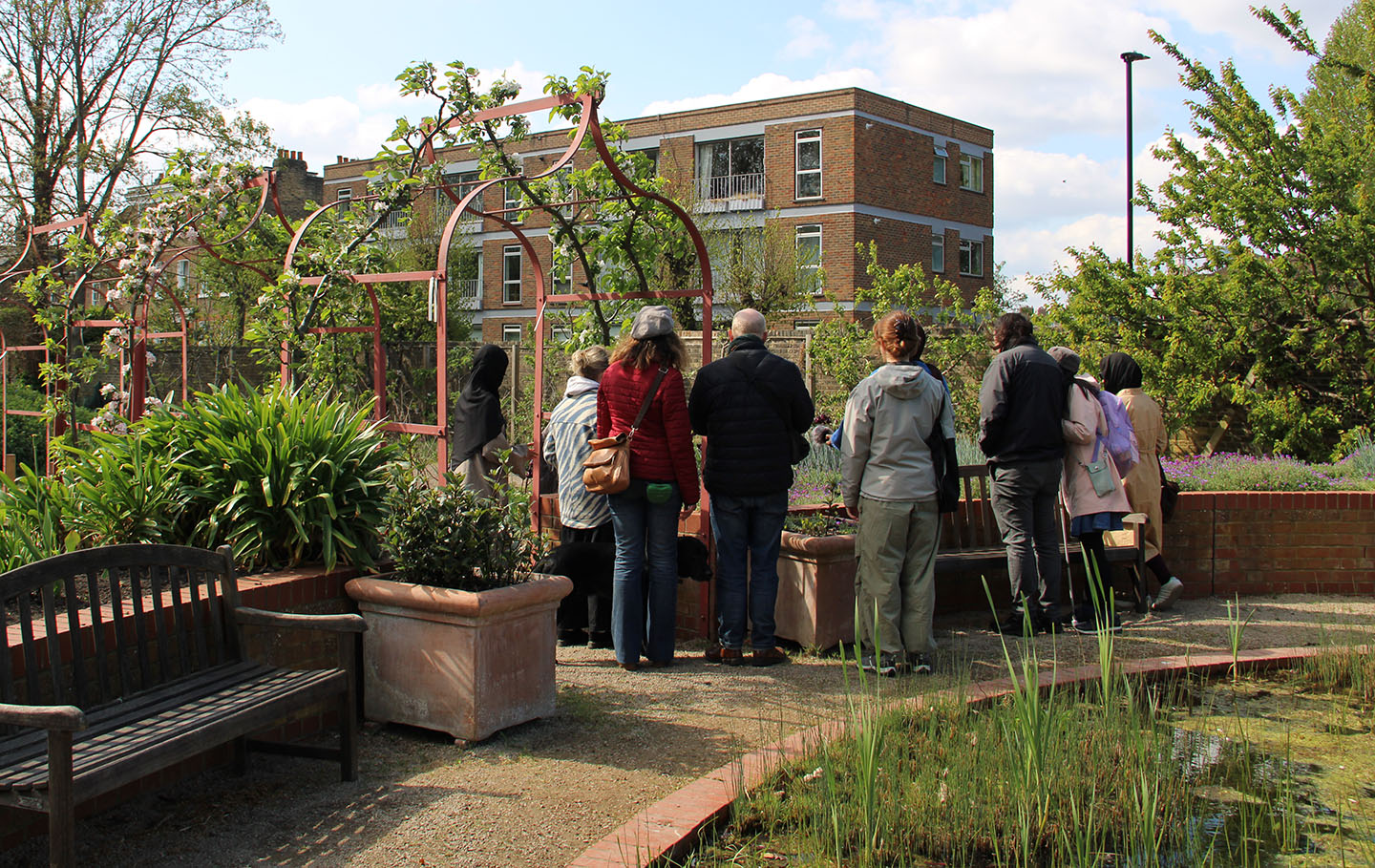 Group of people in the Queen's Orchard