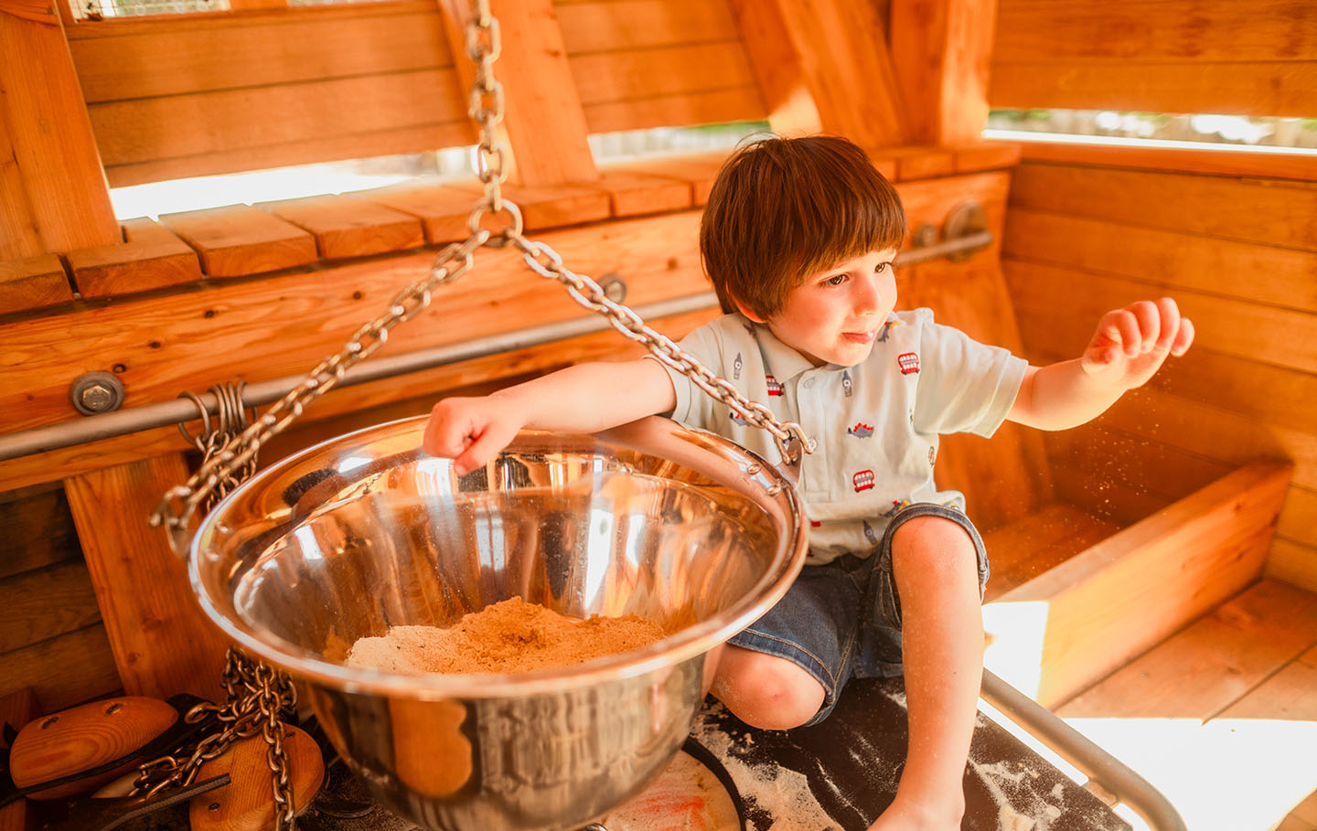 Young boy playing with sand