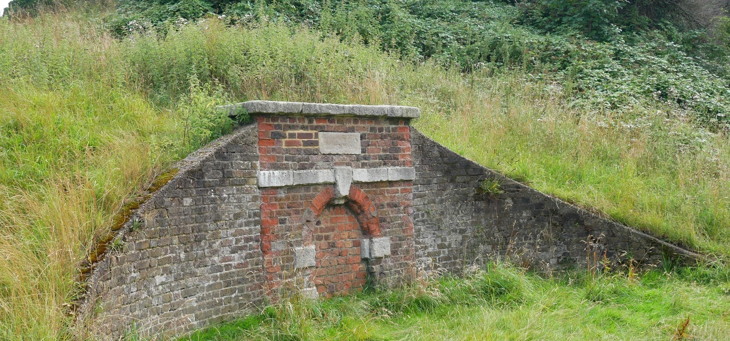 Conduit Head at the base of One Tree Hill - this looks like a curved wall of bricks emerging from a hillside