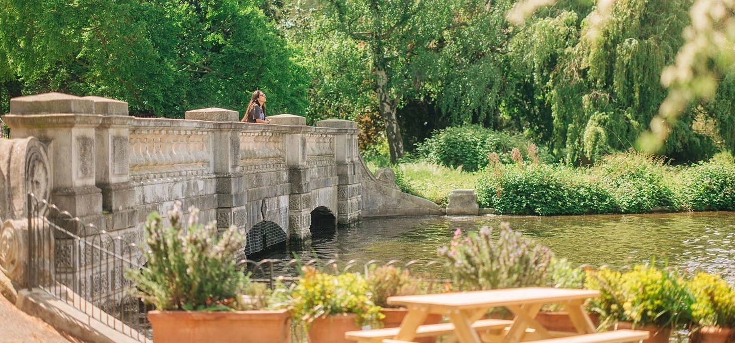 The Dell bridge viewed from outdoor seating at Serpentine Bar & Kitchen