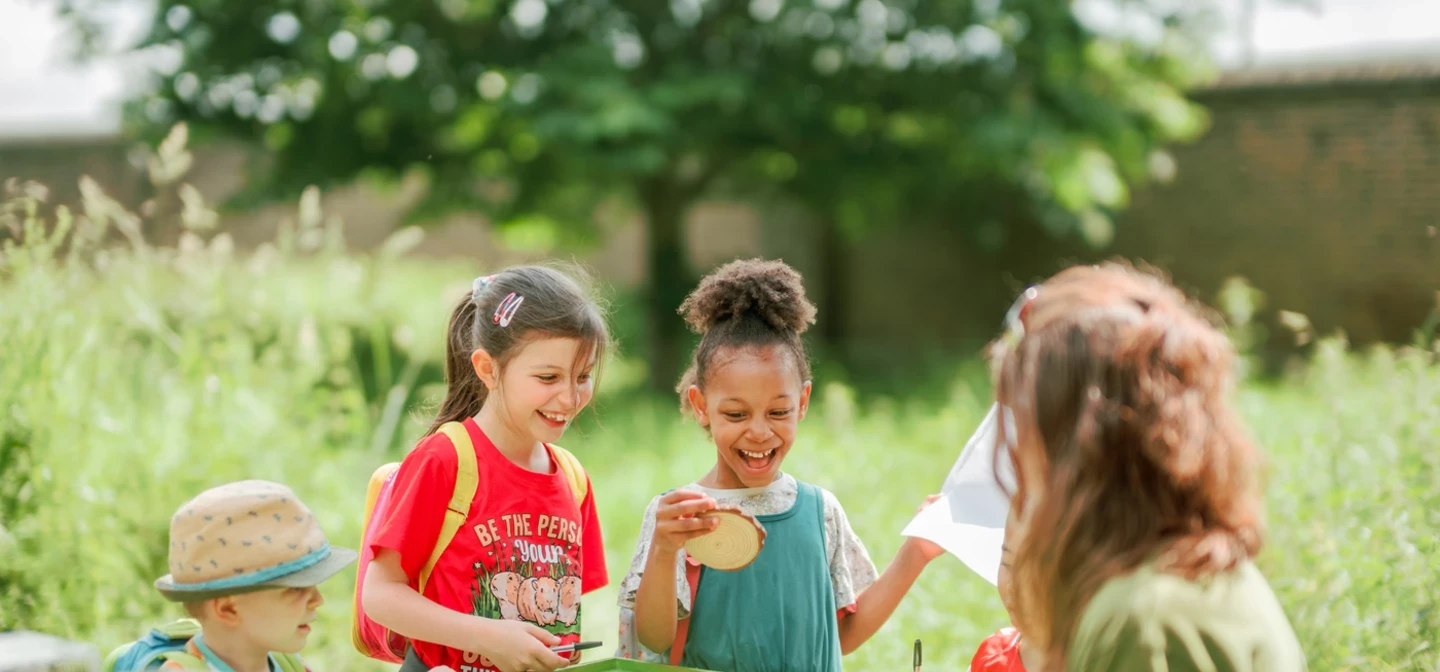 Children playing a quiz game outdoors