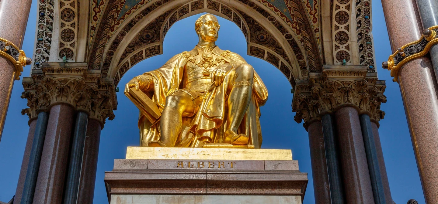 Close-up image of Albert Memorial, a bronze statue sheltered under an ornate arch.