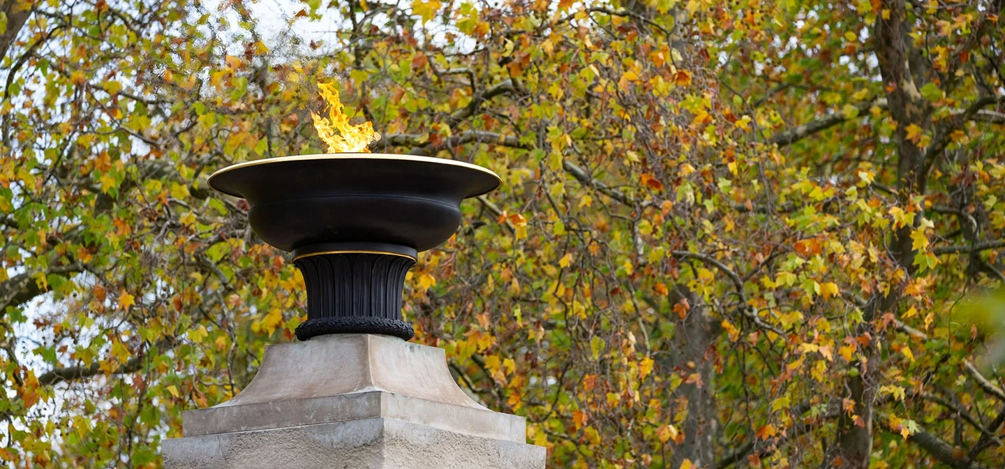 Burning torch on the top of the memorial gates