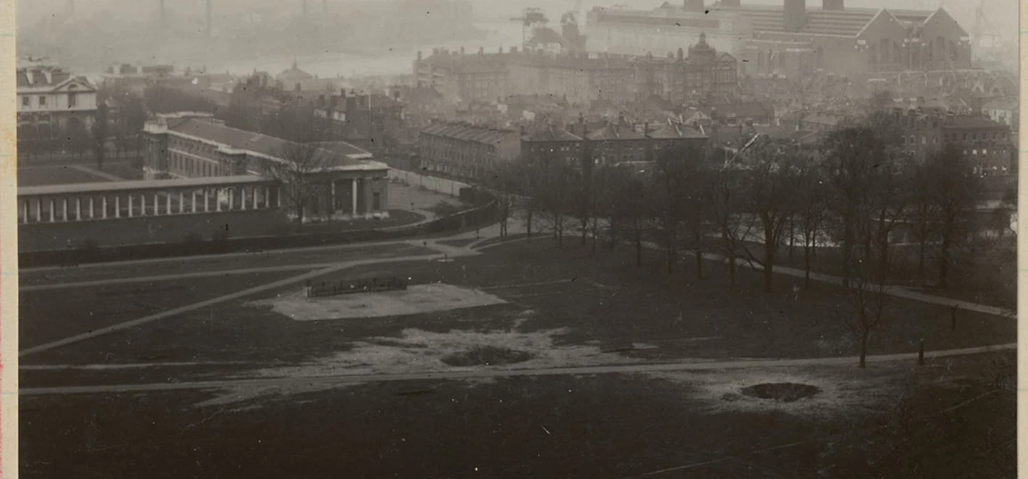 Black and white photograph showing bomb damage to the Queen’s Field 