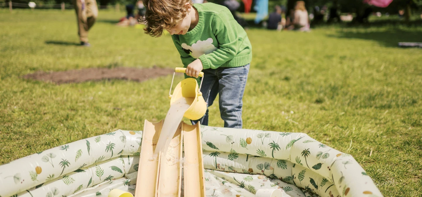 Child playing in park as part of the Play in the Park project