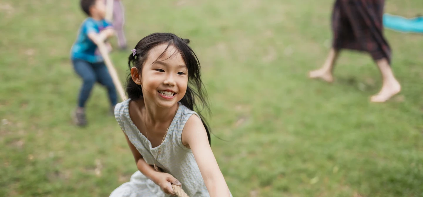 Child playing in park as part of the Play in the Park project