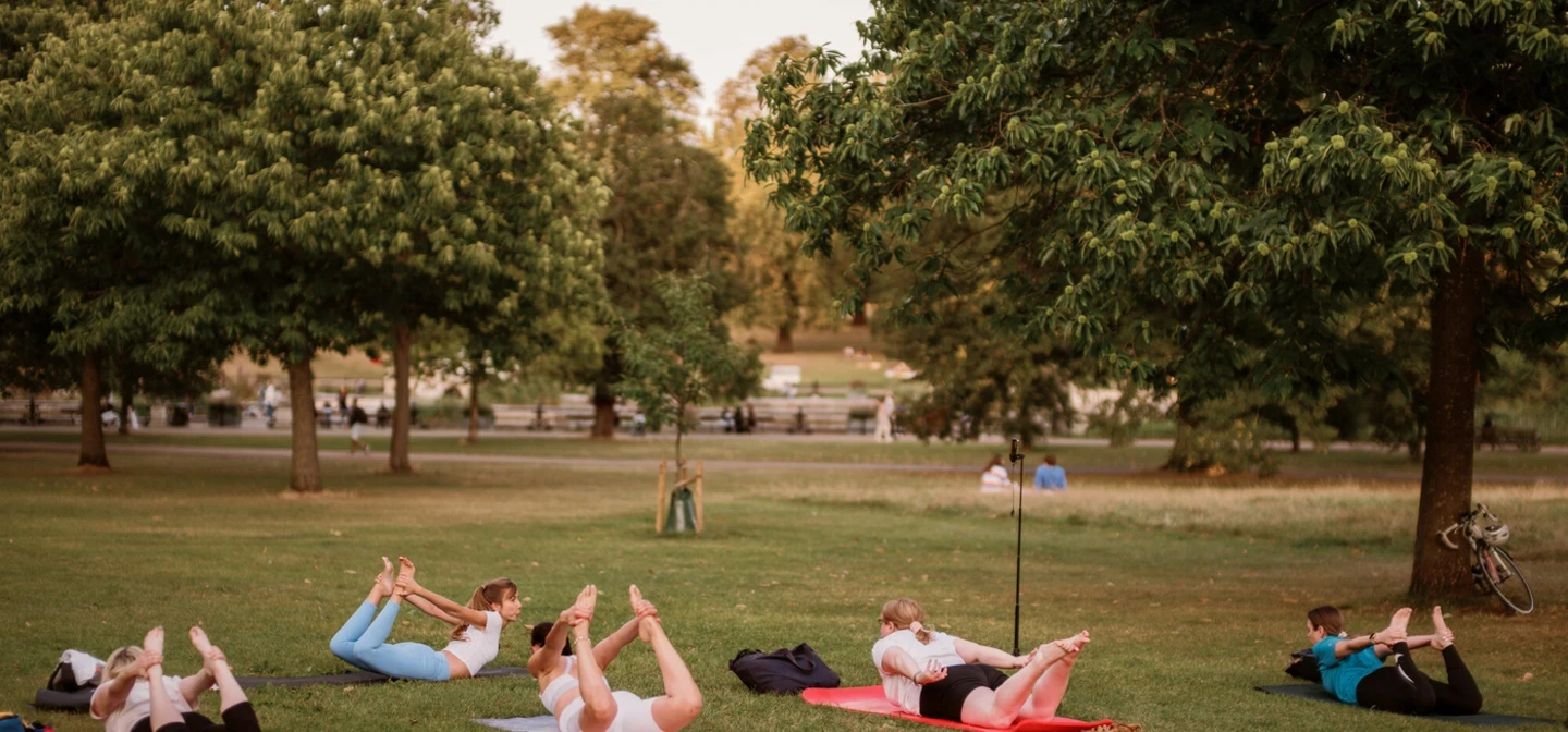 People taking part in yoga in the Royal Parks
