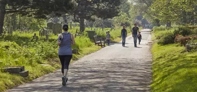 Woman jogging in Brompton cemetery