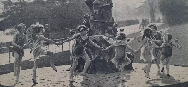 Children dancing around the Peter Pan statue, 1935