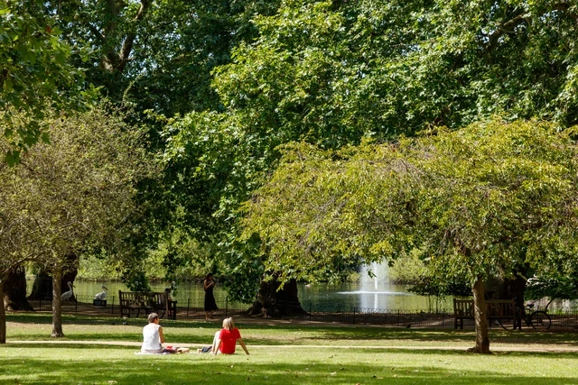 People enjoying the sun in St. James's Park