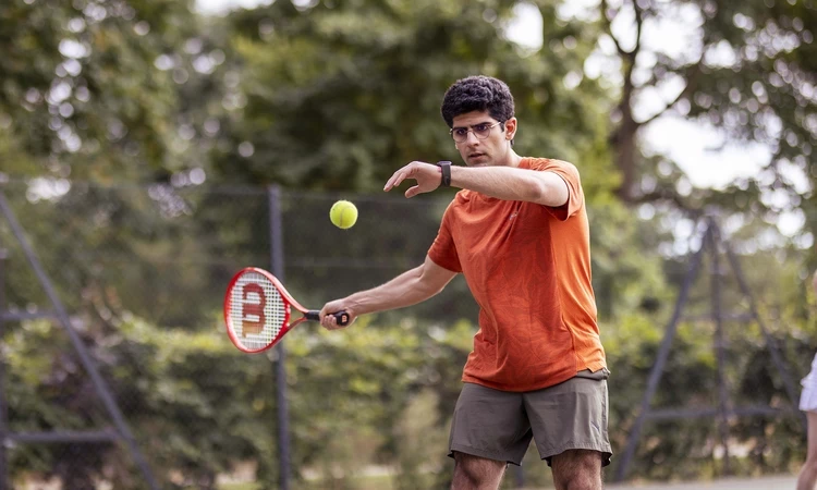 Man playing tennis at Park Sports Greenwich Park