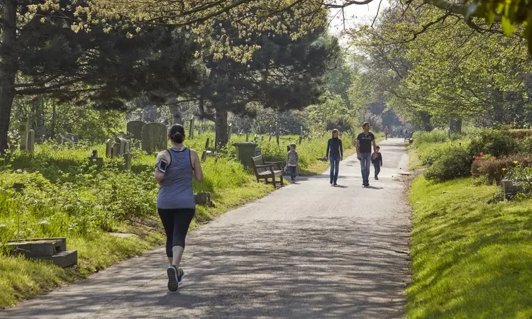 Woman jogging in Brompton cemetery