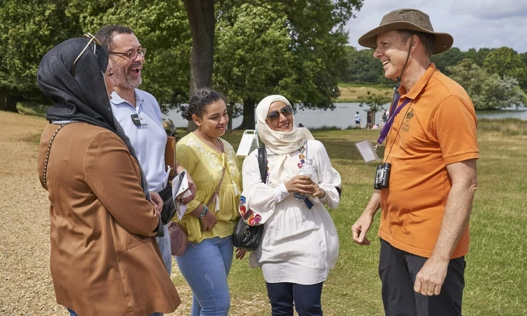 Volunteer Ranger talking to visitors in Richmond Park
