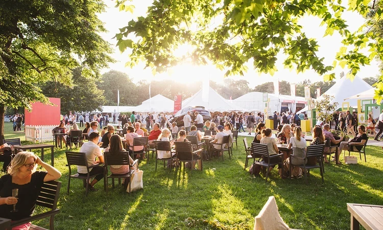 Crowds sitting at Taste of London food festival