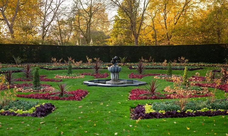 Boy and Frog statue in Queen Mary's Garden in autumn