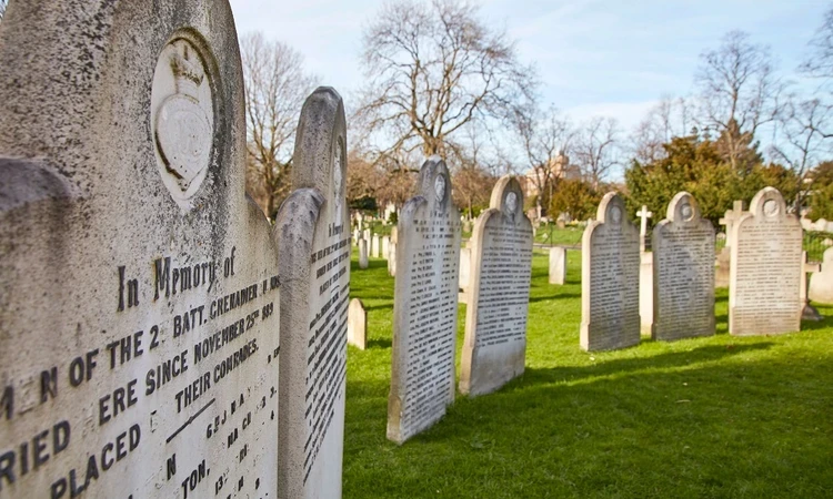 The names of 200 servicemen are recorded on the 18 headstones surrounding the central cross.