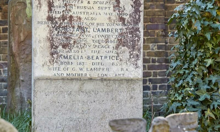 Constant and Kit are remembered on the same large gravestone, while Flo’s smaller memorial stands in front.