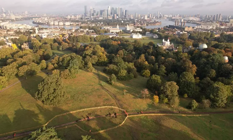 An aerial view of Greenwich Park and the Saxon Barrow Cemeteries with Canary Wharf in the distance
