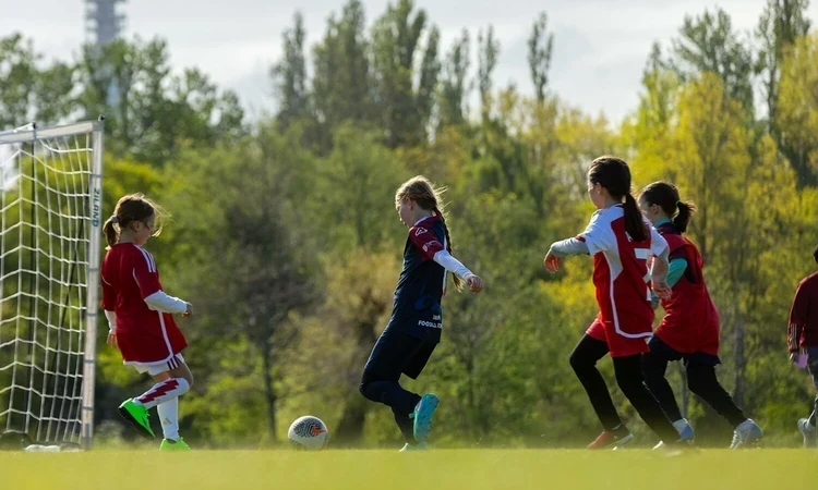 Young girls playing football