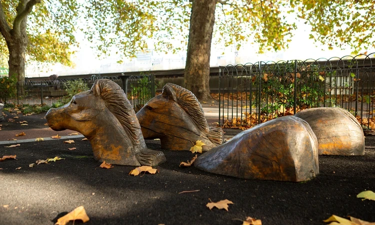Wooden carved horses at Horseferry playground