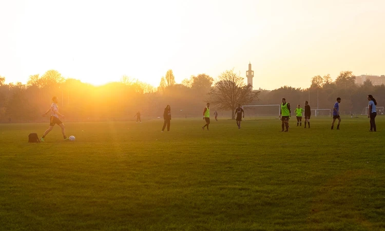 A football match at sunset