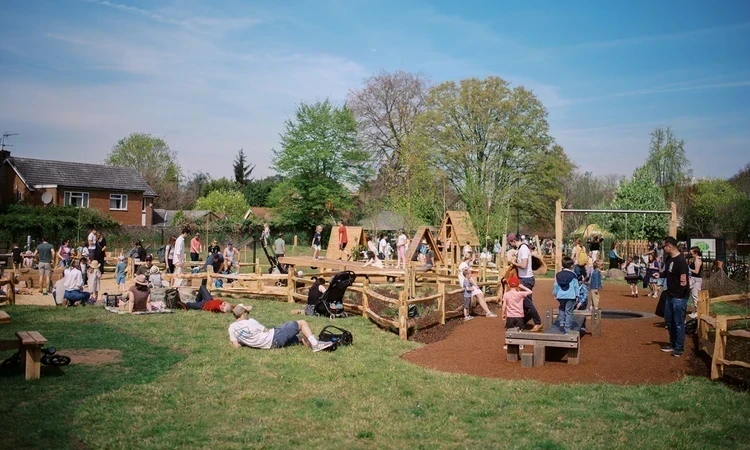 A busy playground on a sunny spring day