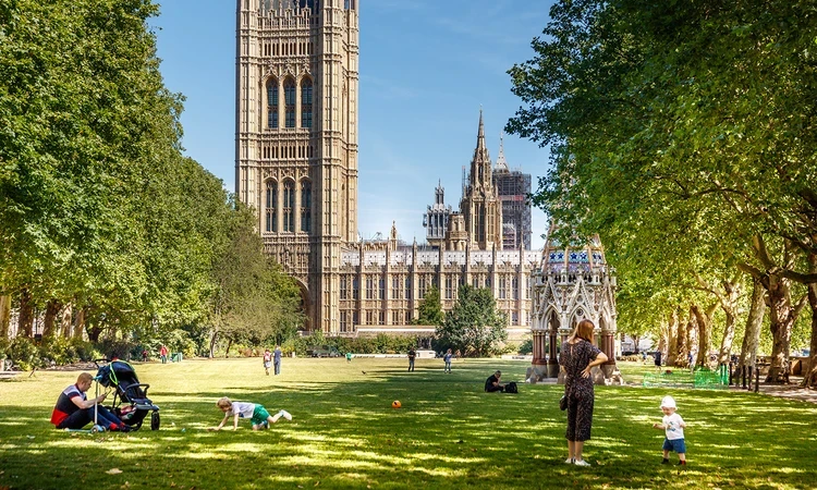 Families enjoying summer sunshine in the park
