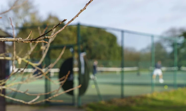 An out of focus shot of a tennis court