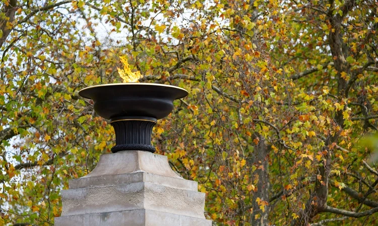 Burning torch on the top of the memorial gates