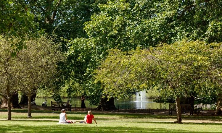 People enjoying the sun in St. James's Park