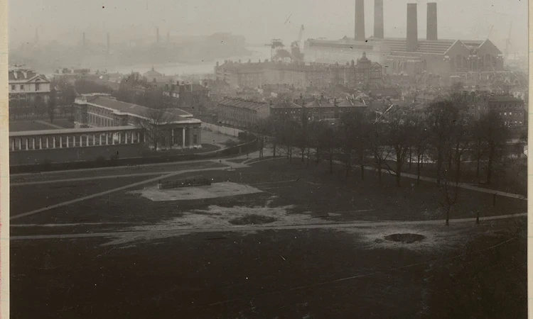 Black and white photograph showing bomb damage to the Queen’s Field 
