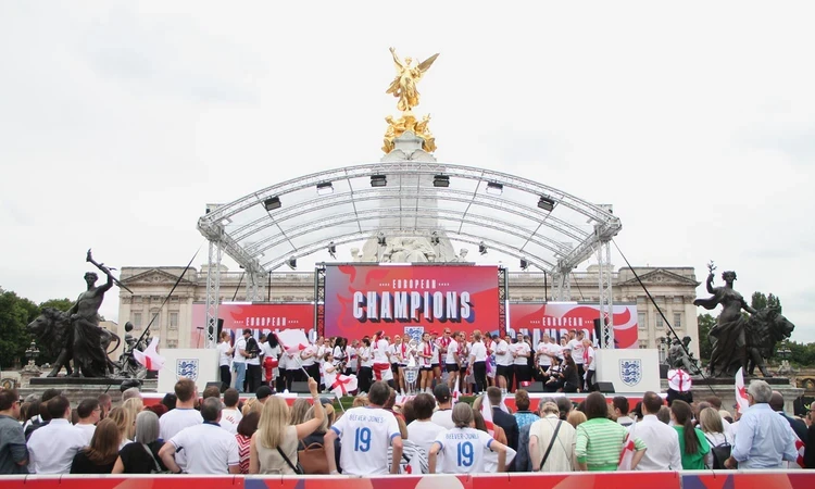 England women's football team on stage at the Queen Victoria Memorial