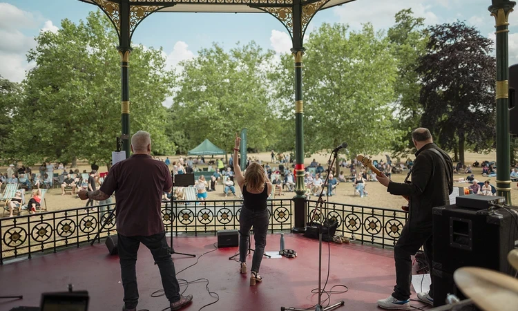 A band plays to the crowd on a summer's day
