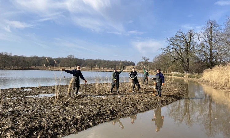 Slow the Flow project volunteers in ponds with spades