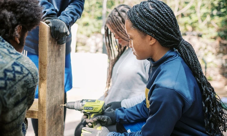 A Green Futures student using a cordless drill