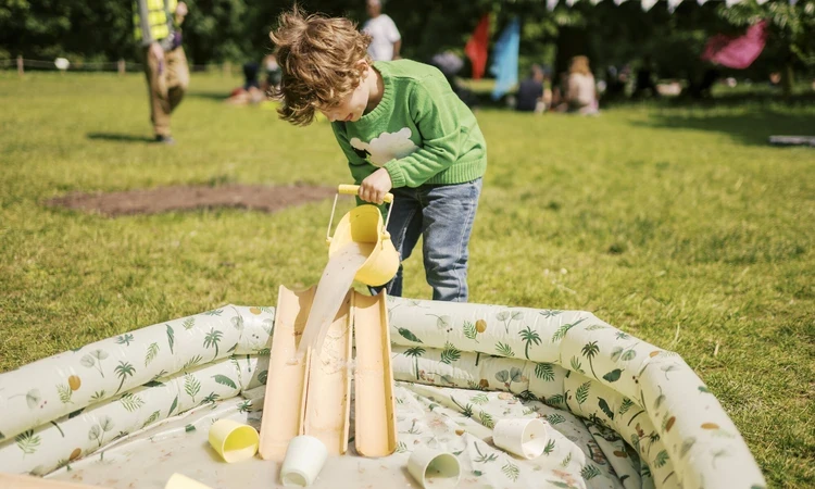 Child playing in park as part of the Play in the Park project
