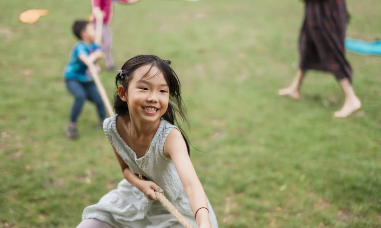 Child playing in park as part of the Play in the Park project