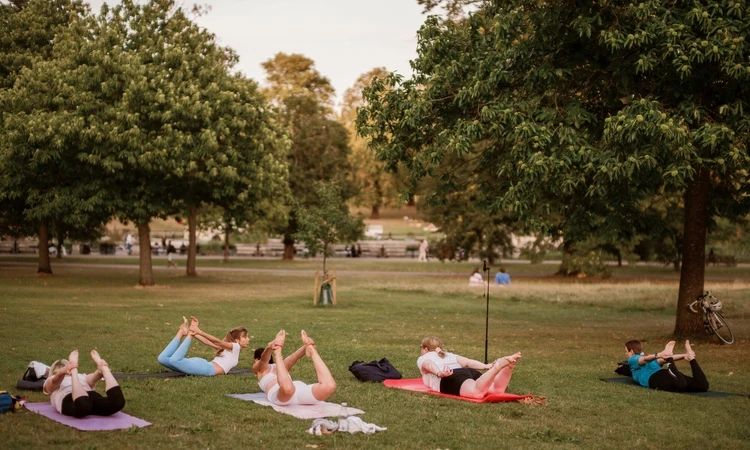 People taking part in yoga in the Royal Parks