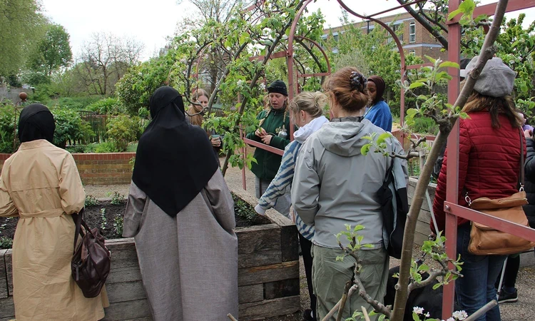 Group of people in the Queen's Orchard