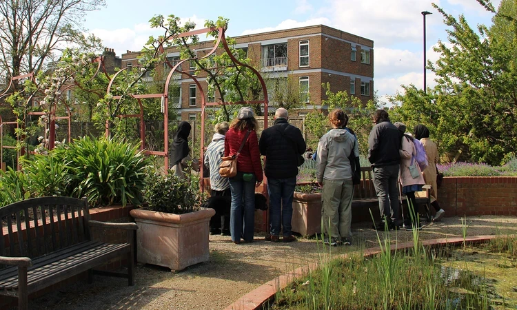 Group of people in the Queen's Orchard