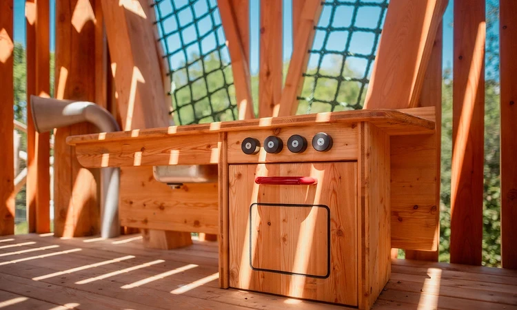 Play kitchen inside the new treehouse